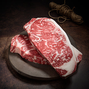 This 7+ graded Australian Wagyu split cut strip loin steak is marbled beautifully and cuts like butter, it is from Rangers Valley in Glen Innes, Australia. We hand select each loin prior to purchase to ensure that we offer nothing but the finest Wagyu on the Market.  crooked butcher meats